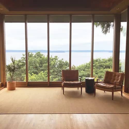 Ravenna Honey area rug in sun room with water view