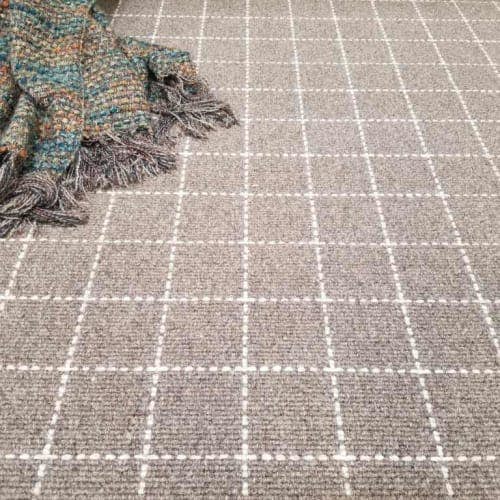 symmetry: the grid-like pattern of city block wool carpet (color brown beige)
