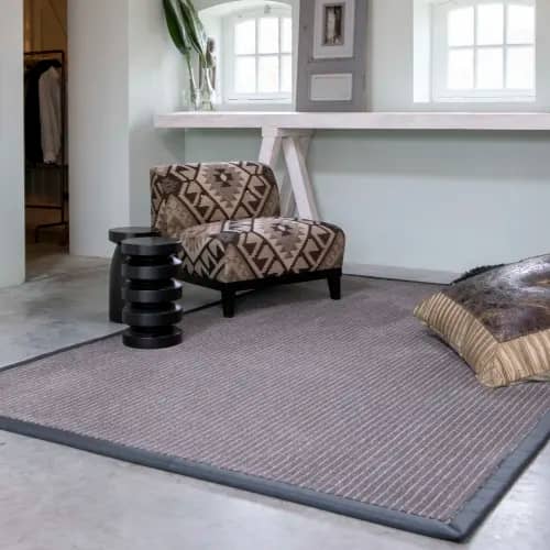 Chalk Route wool rug with leather border in sitting room