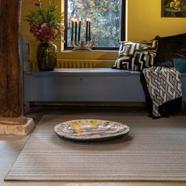 Masai Nude wool rug with blind soft border in rustic room